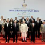 PM in a group photograph with BRICS leaders during the BRICS Business Forum 2026 on the sidelines of the 18th BRICS Summit at Bharat Mandapam, in New Delhi.
