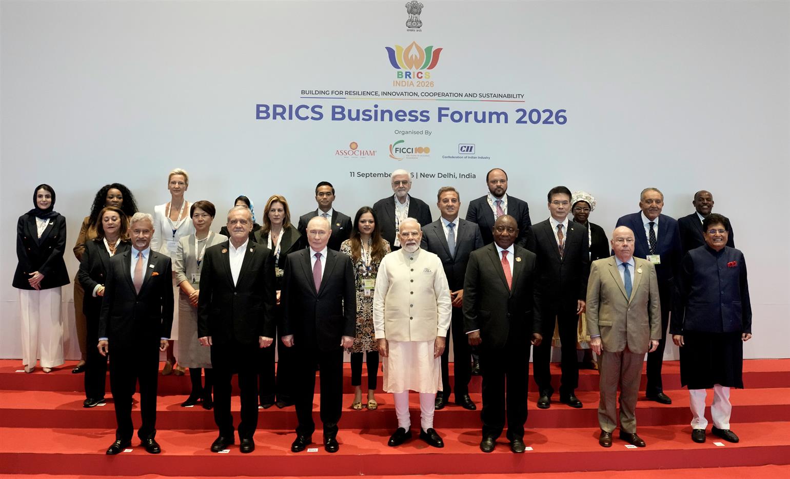 PM in a group photograph with BRICS leaders during the BRICS Business Forum 2026 on the sidelines of the 18th BRICS Summit at Bharat Mandapam, in New Delhi.